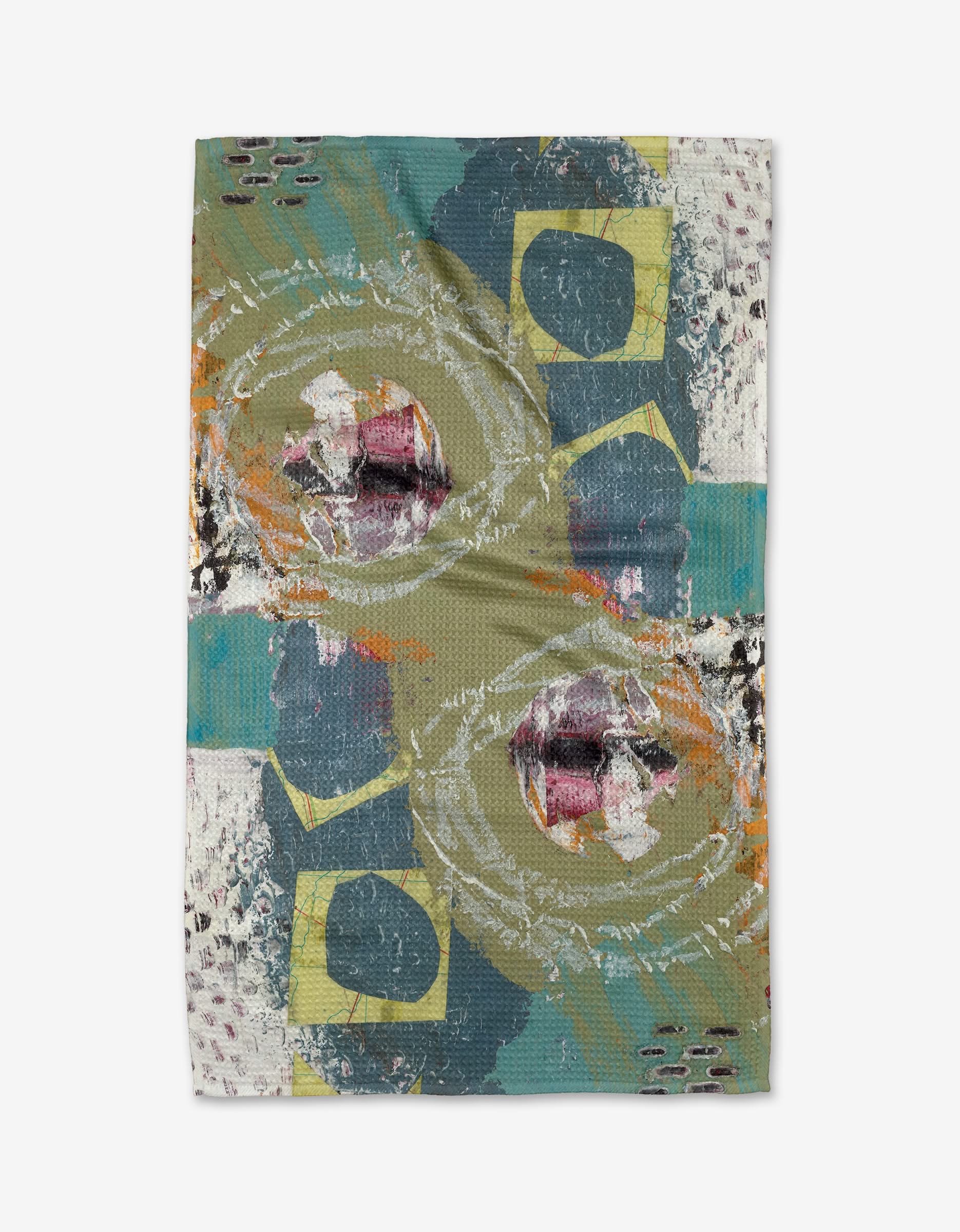 The “It’s All In a Day’s Work” tea towel by Katherine Berkeley features a rectangular shape and modern abstract design in green, teal, yellow, orange, black, and white on eco-friendly geoweave fabric.