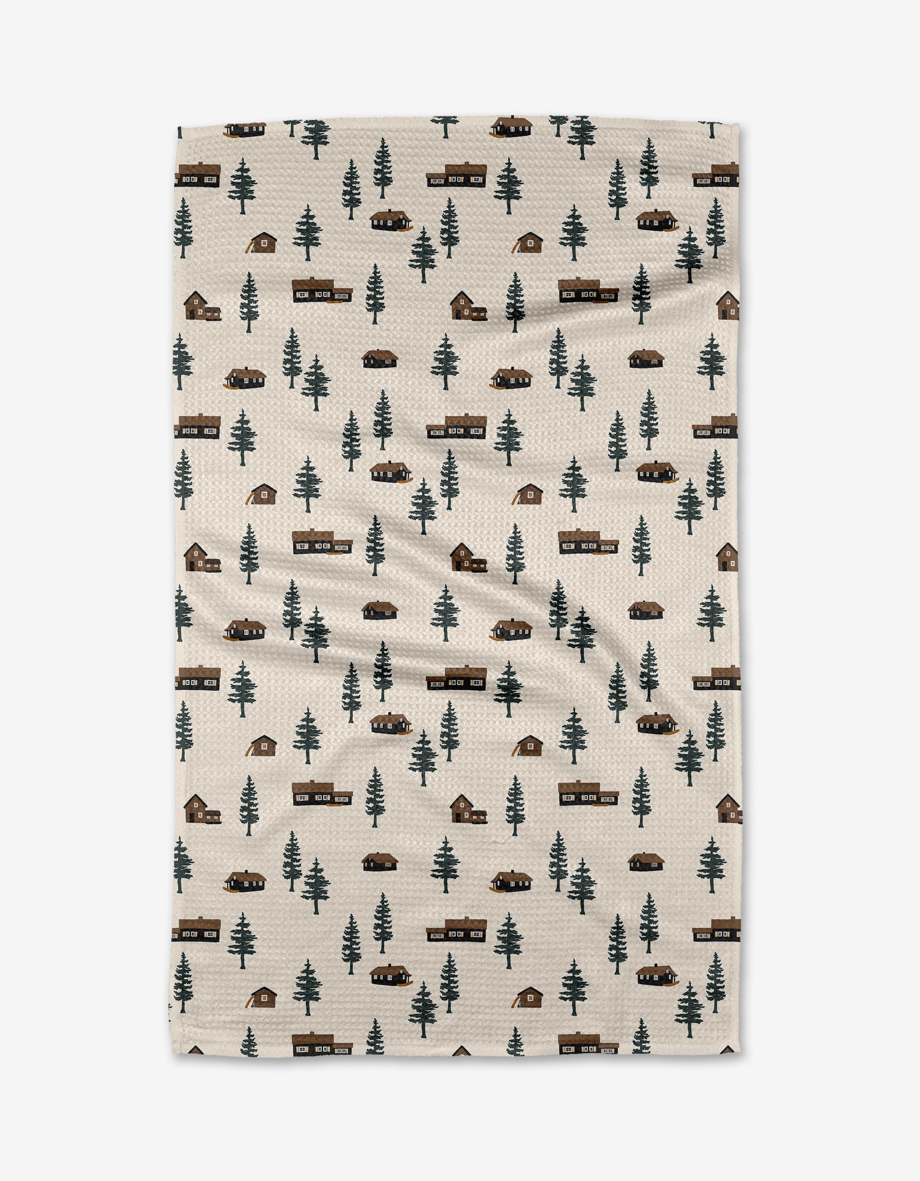 The Lakehouse Cabins tea towel by Coit Creative features green pine trees, brown cabins, cars, and campfires in rows. Ultra-absorbent and made from recycled materials, it has a subtle textured look in beige.