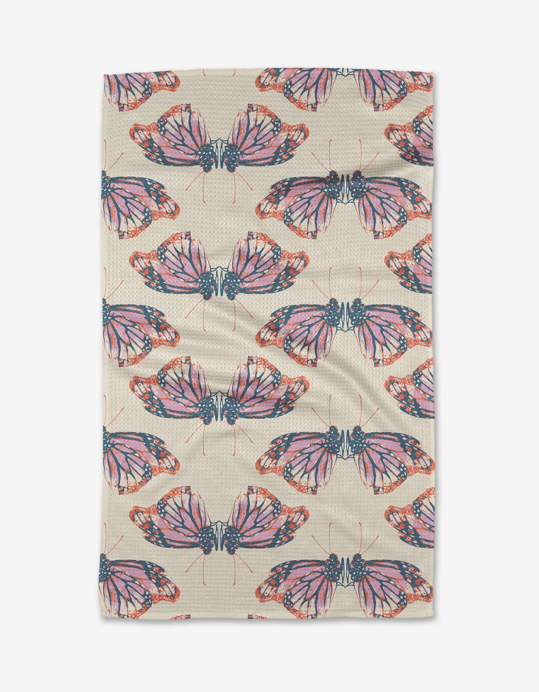 The Mimicry tea towel by Rebecca Woolbright features beige Geoweave fabric with rows of vibrant orange and pink monarch butterflies and dark blue accents.
