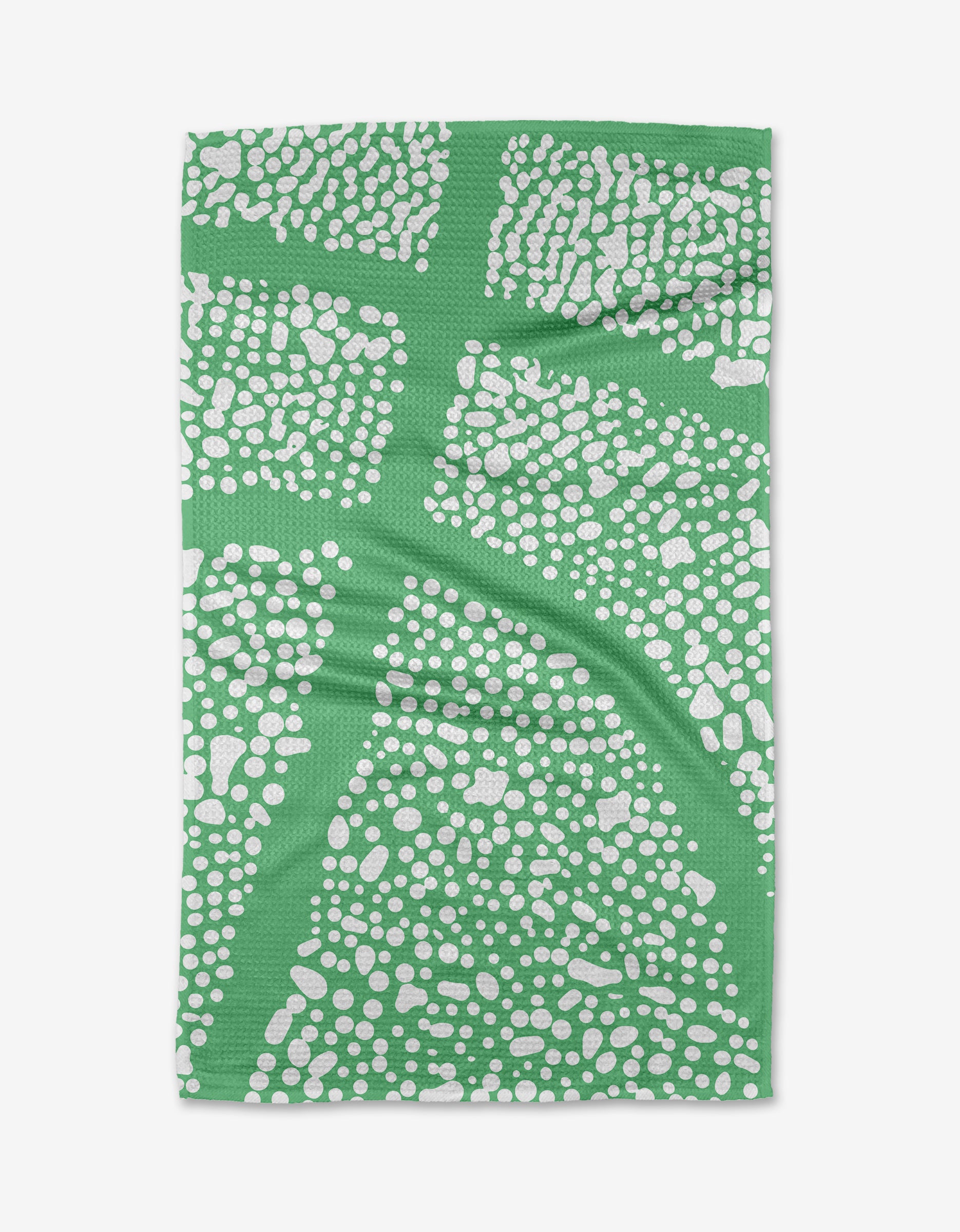 The Sissy Moon Moon Rock tea towel is a rectangular green Geoweave fabric with white dotted abstract clusters and curved lines. Its ultra-absorbent, modern design is shown laid flat on a white background.