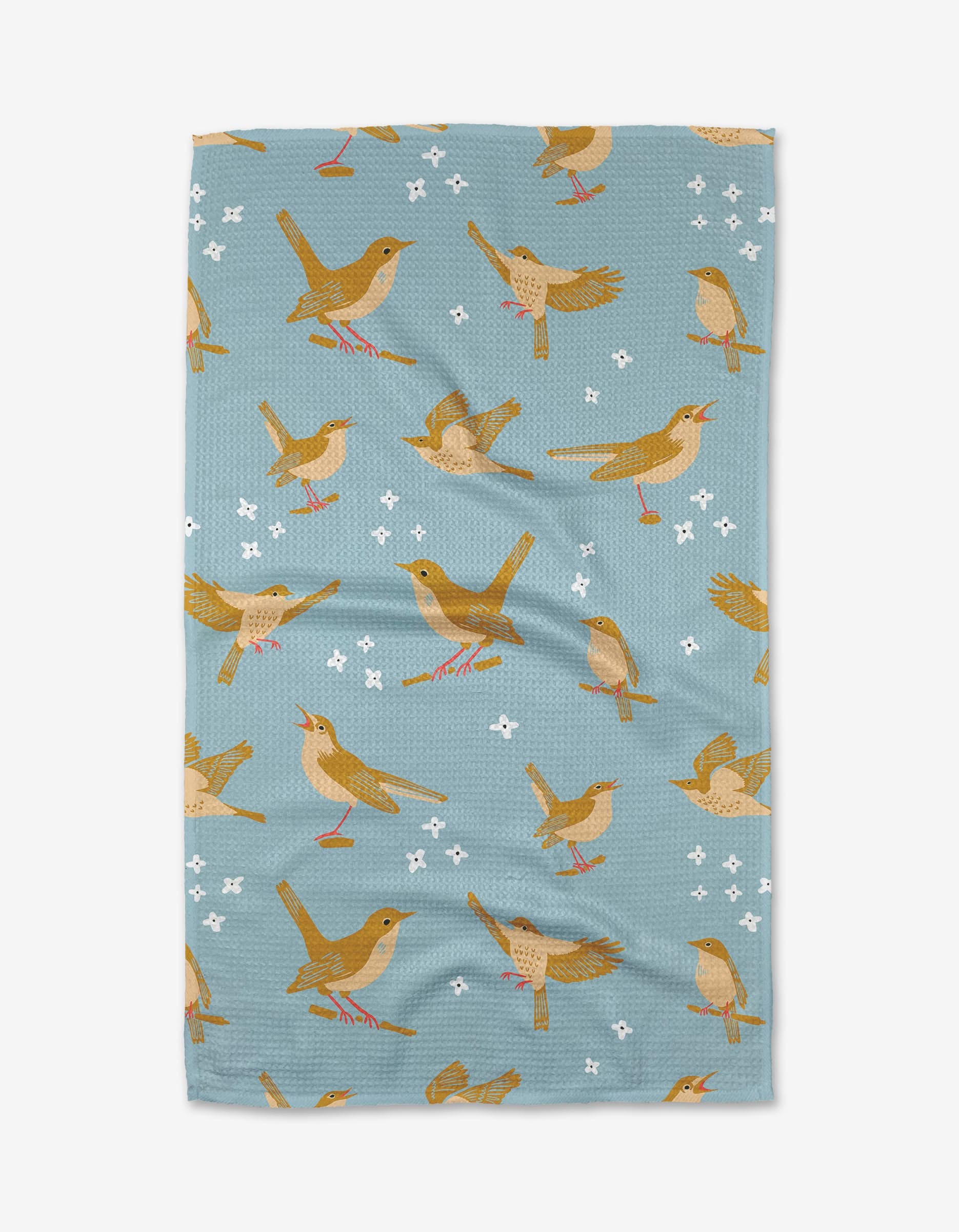The Nightingales tea towel by Elisabeth Wing is blue, made from recycled materials, and features small brown birds with red beaks and legs in various poses, along with white flowers, repeating across the fabric.