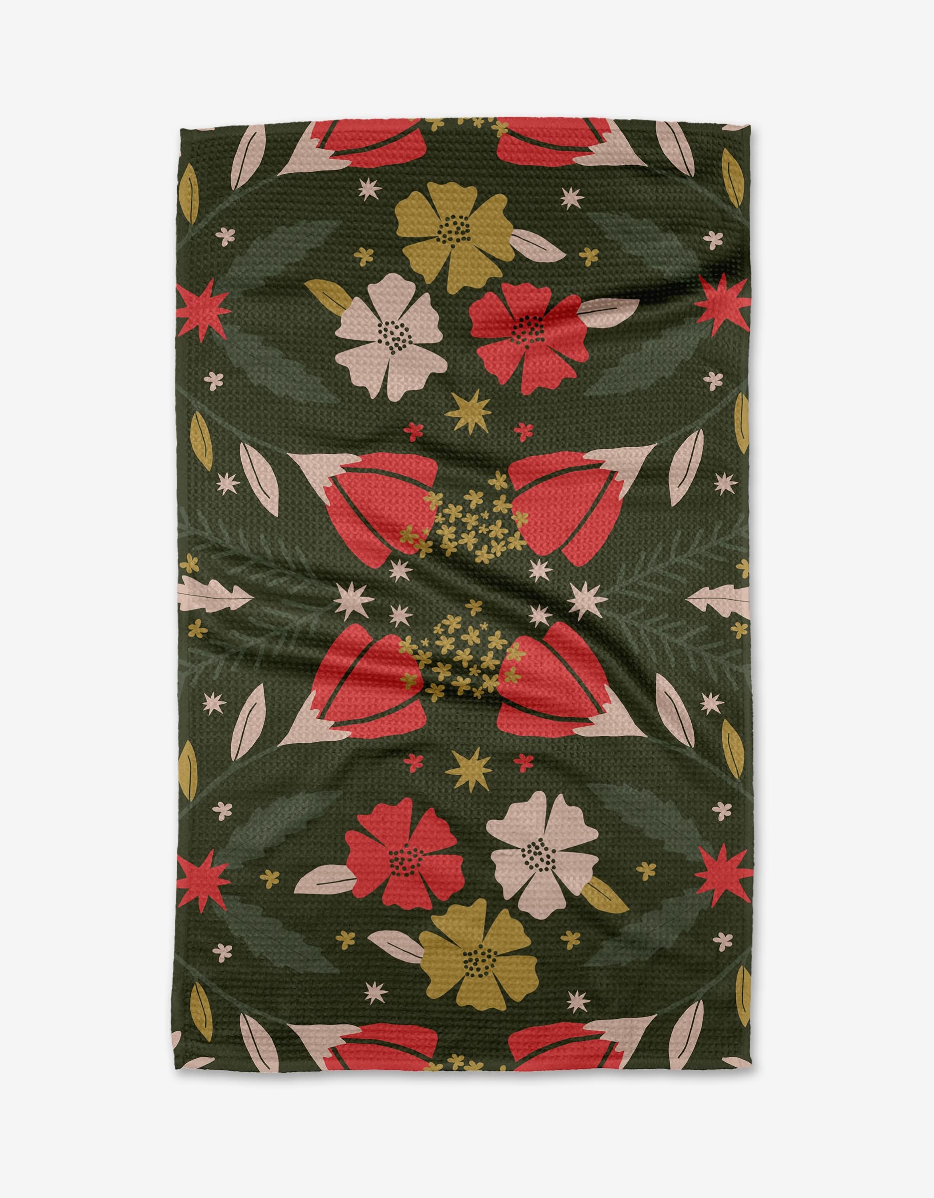 The Ash Cascade Noel Forest recycled kitchen towel features a green background with a symmetrical floral pattern in red, yellow, pink, and white, adorned with various flowers and leaves. Slight fabric wrinkles are present.