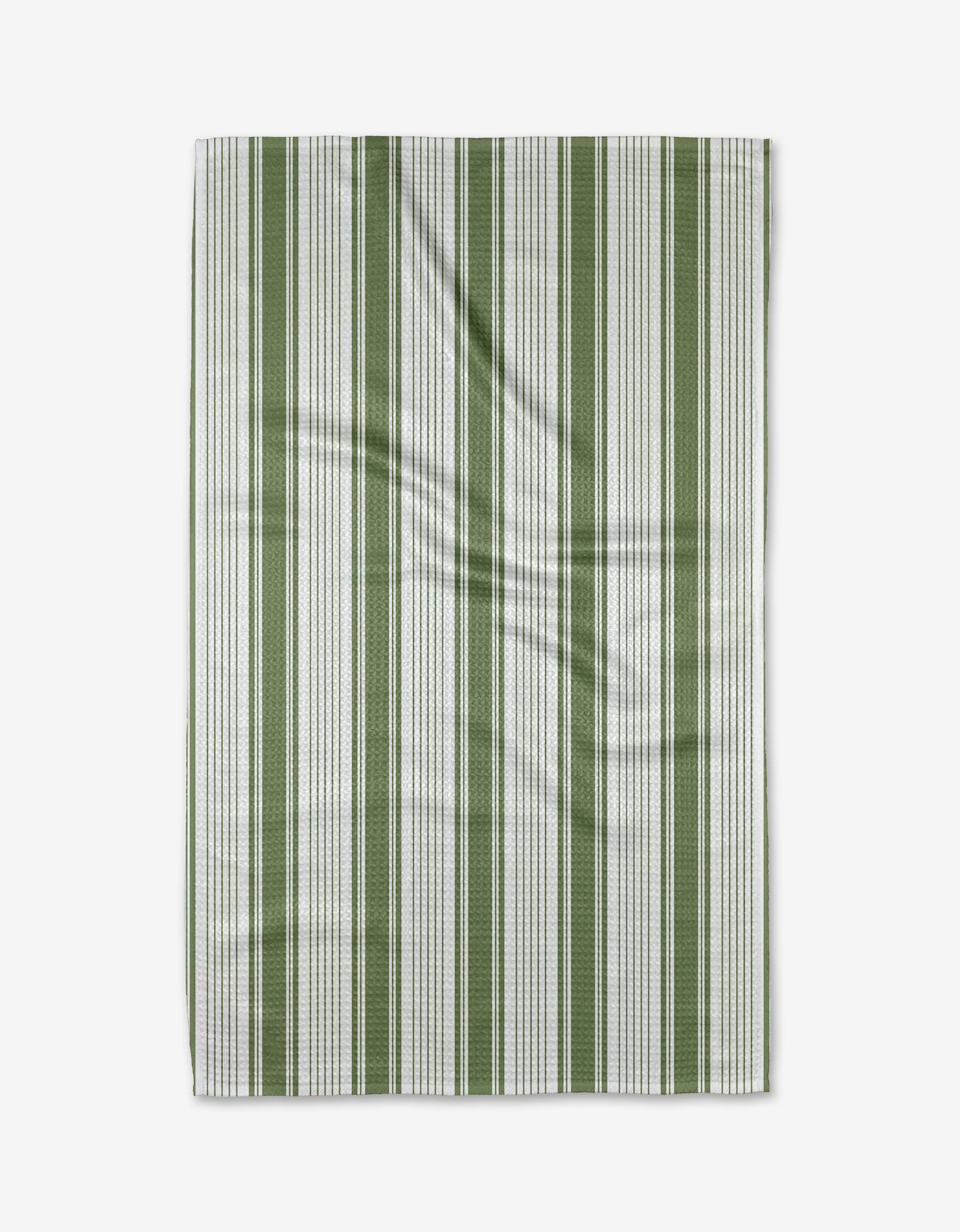 The Aubrey Fairchild Of the Same Stripe tea towel features vertical green and white stripes on Geoweave™ fabric, adding subtle texture and slight wrinkles, displayed against a white background.