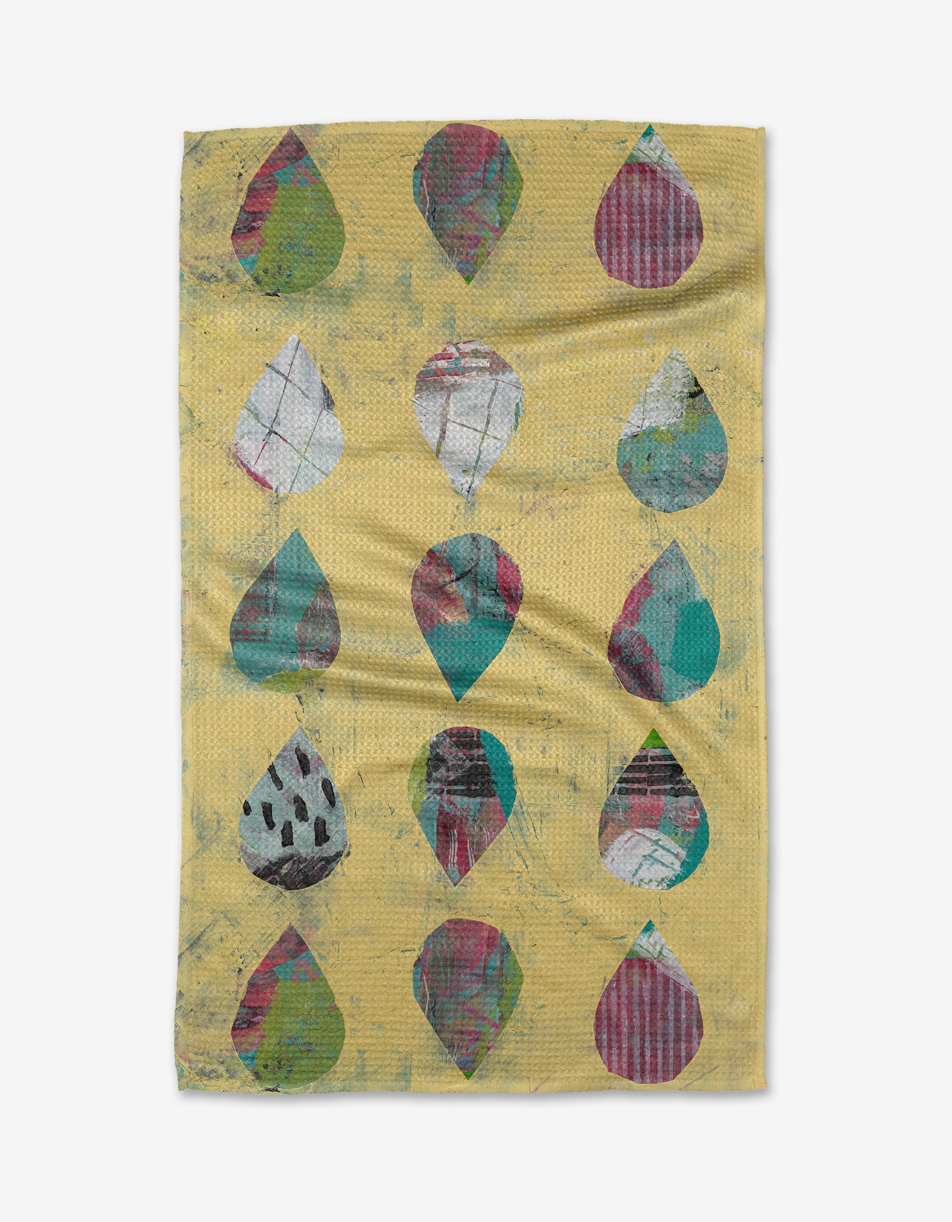 Outer Limits by Katherine Berkeley is a yellow tea towel with sixteen colorful, abstract teardrop designs in green, red, white, and black. Made of Geoweave fabric, it features a textured and slightly wrinkled look.