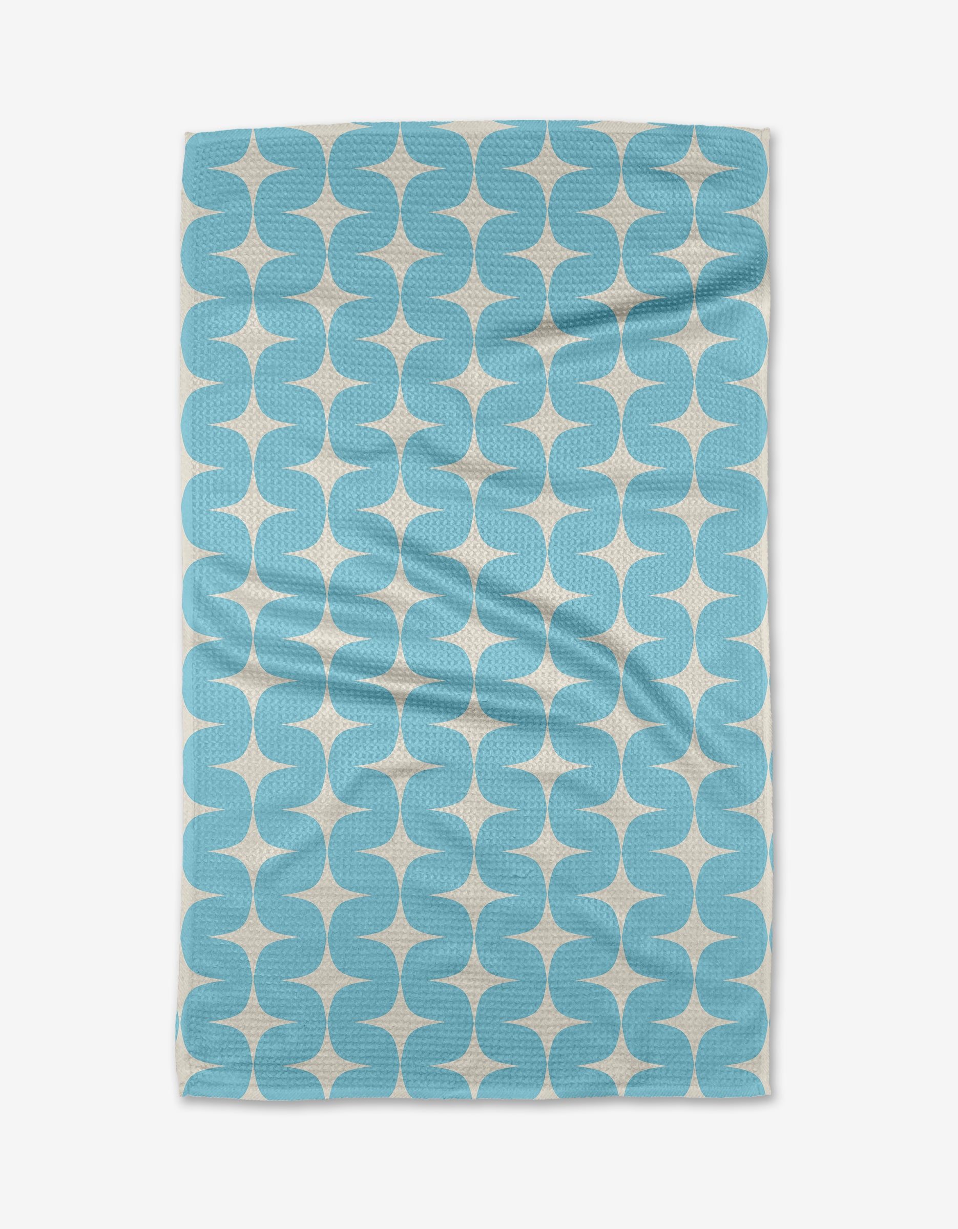 The Over the River towel by Mindfulnice is a quick-drying, rectangular towel with a retro geometric light blue and white pattern on textured fabric. Shown laid flat with slight wrinkles.