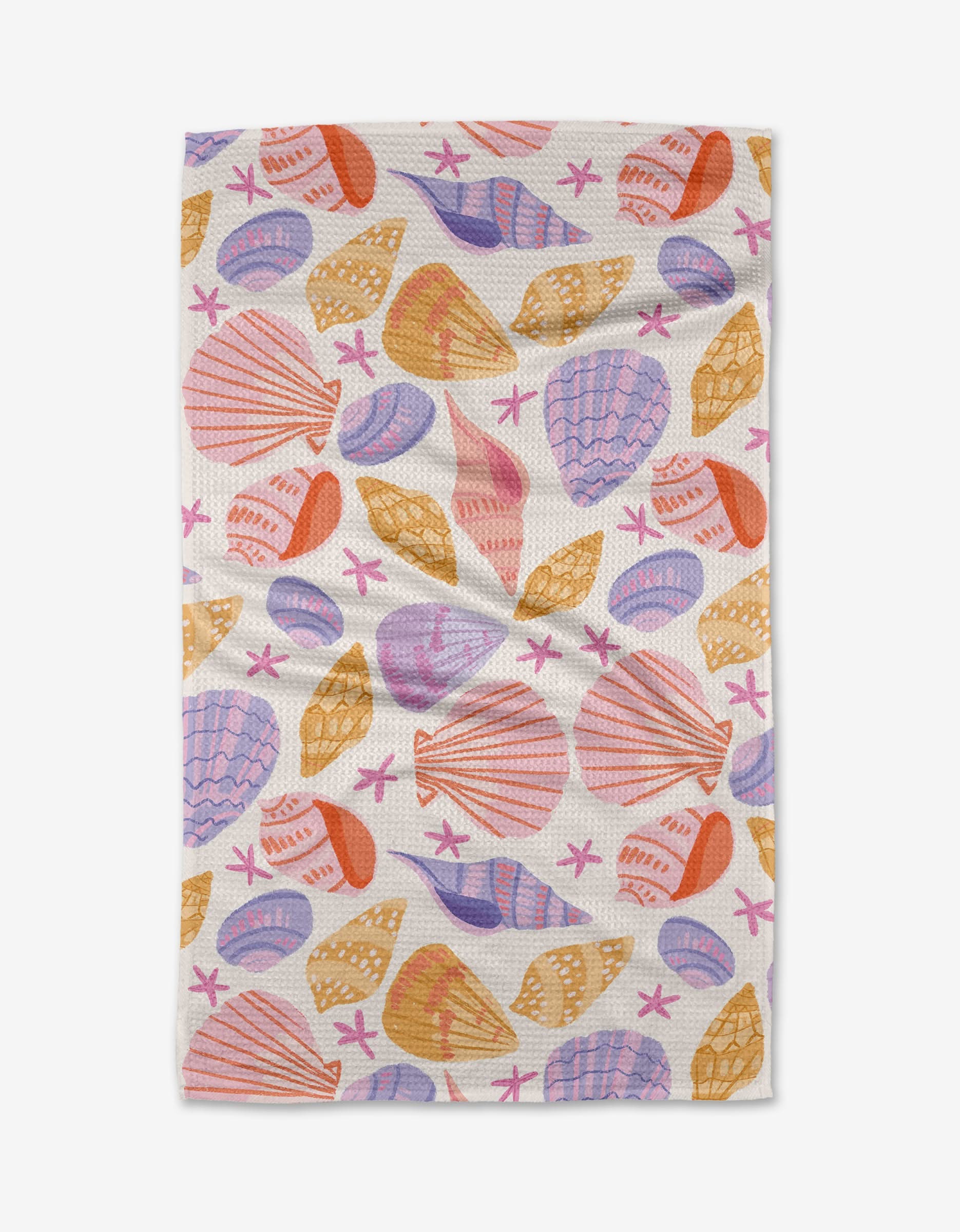 The Painted Shells tea towel by Janna Sue Design is made from recycled materials and features a vibrant pattern of orange, pink, yellow, and purple seashells and starfish.