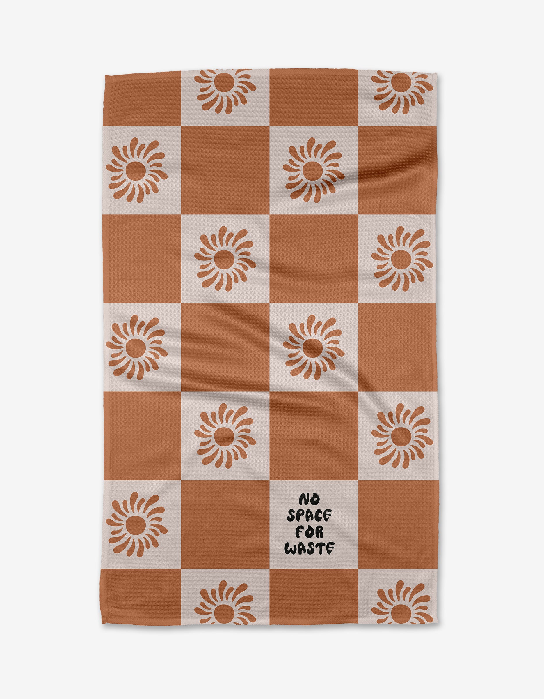 The Realm Refillery Checker by Realm Refillery is a checkered tea towel with rusty brown and white squares, sunflower accents, and NO SPACE FOR WASTE on one white square, all crafted from recycled materials.