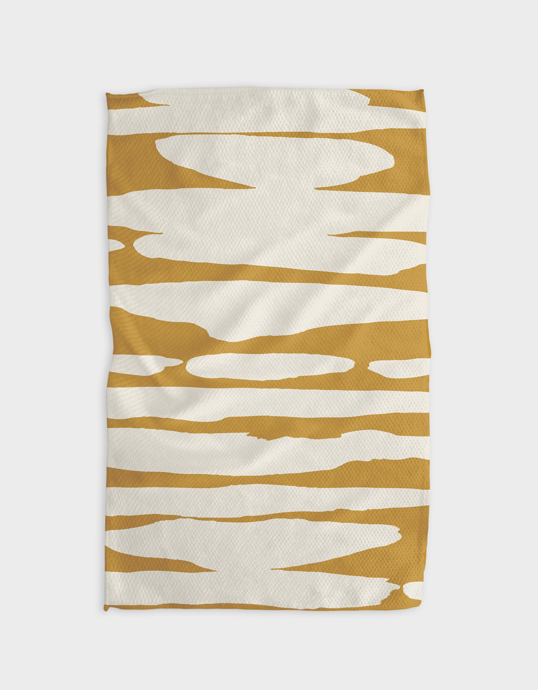 The Reflected - Midday blanket by GEOMETRY features an abstract pattern of irregular gold stripes on white. Made with recycled materials, its varied stripe thicknesses create a modern, eco-friendly design.