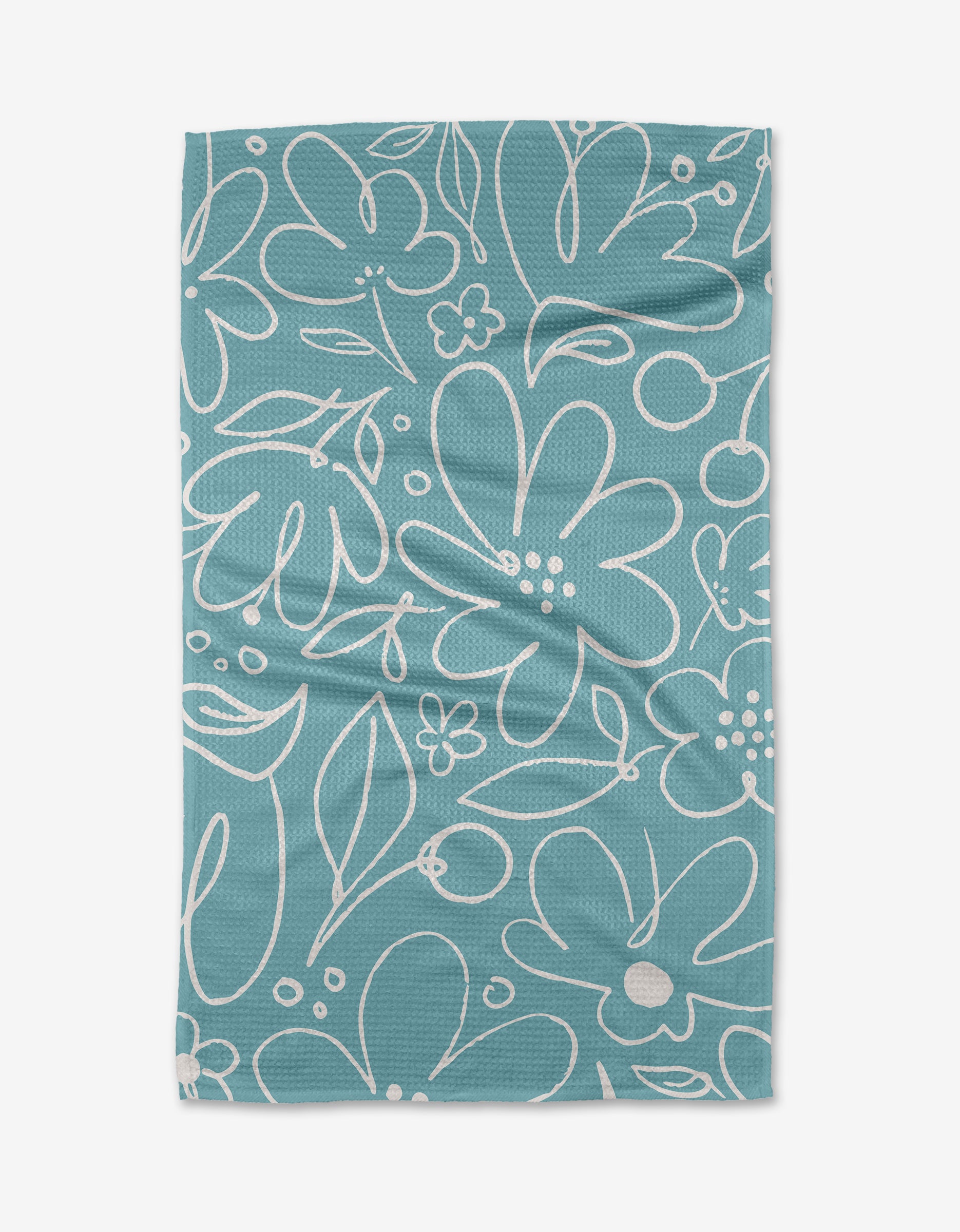 The Sara Mari River Blossom tea towel features a rectangular teal design with ultra-absorbent Geoweave fabric and a white abstract floral and leaf pattern, including large and small flowers, leaves, and dots.