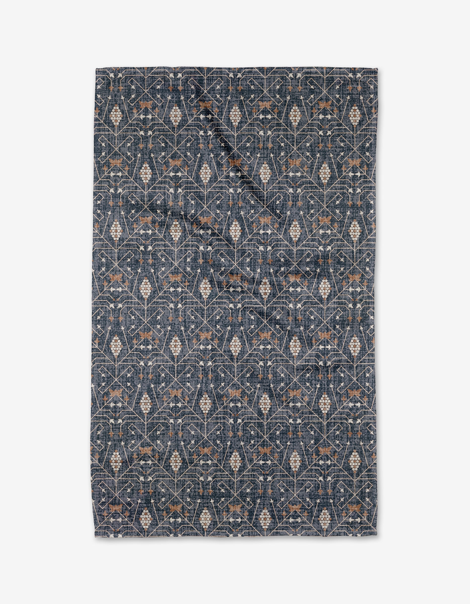 The Rulon Blue quilt by Becki Owens features an intricate floral and vine pattern in beige and light brown on dark blue, crafted from recycled materials, shown flat on a white background.