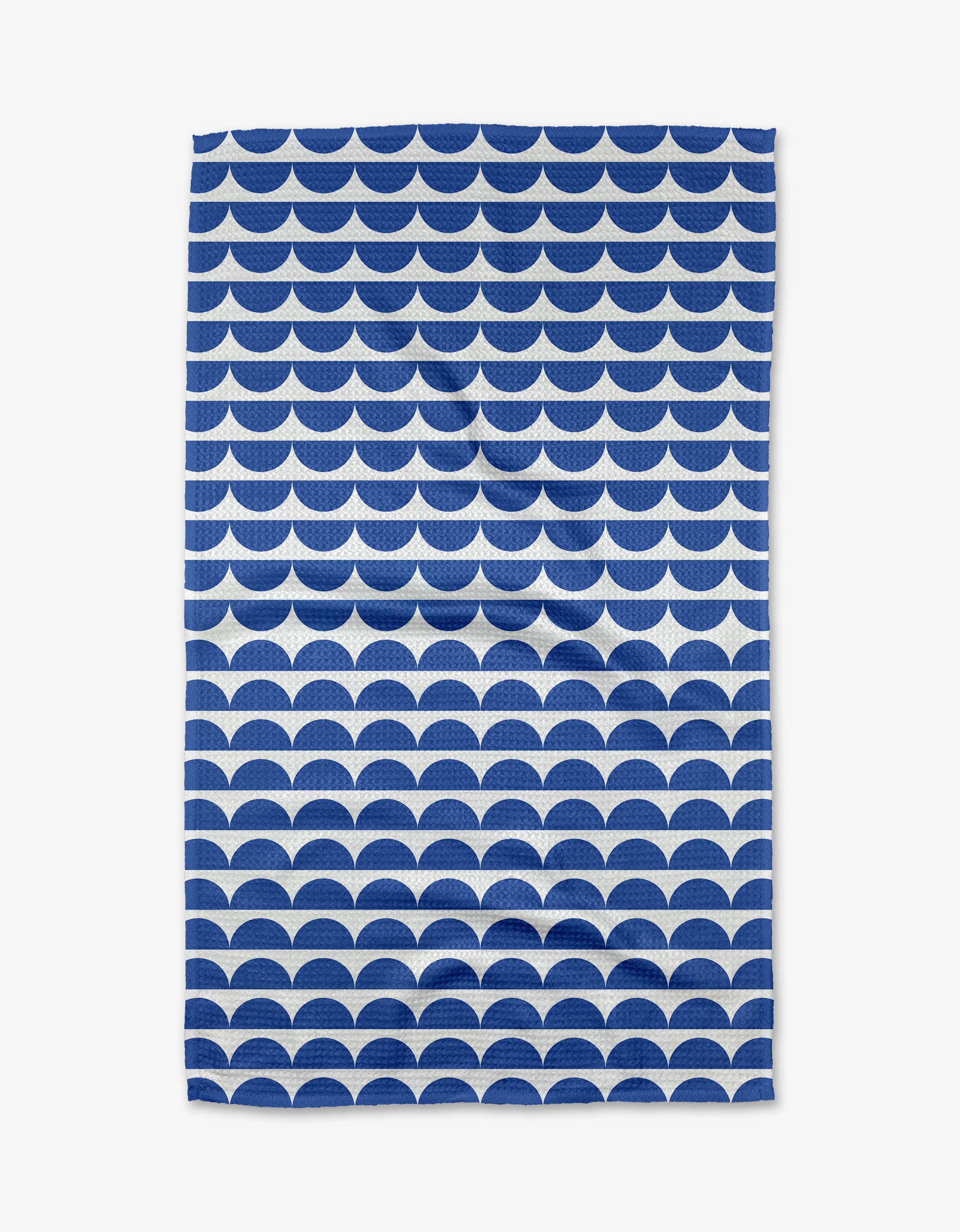 The Buy Guide’s Scallops - Navy towel features a repeating navy and white scallop pattern on white Geoweave fabric, offering an ultra-absorbent and stylish rectangular design.