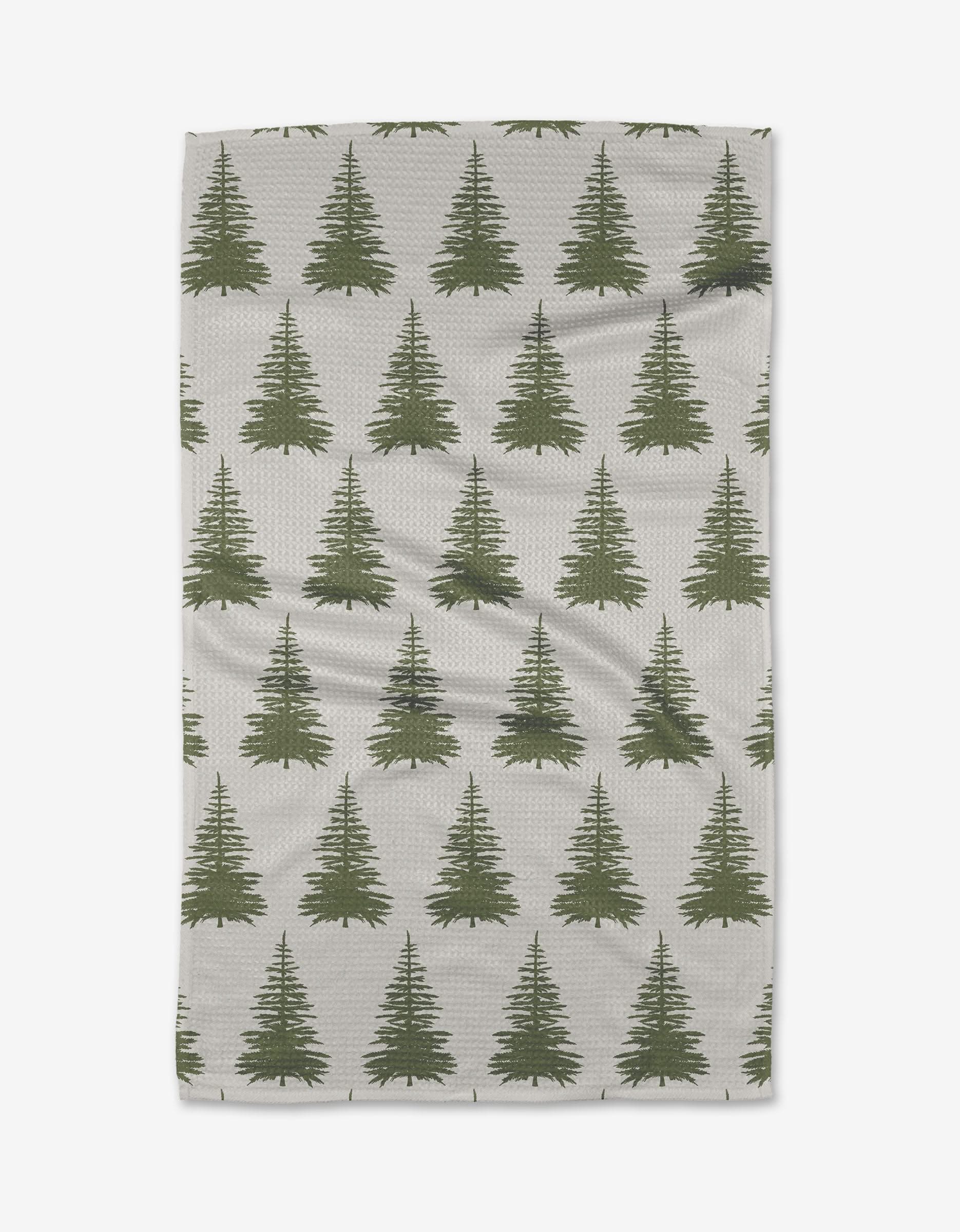The Silver Tip tea towel by Becki Owens is light gray with a repeating pattern of green pine trees in neat rows, crafted from recycled materials.