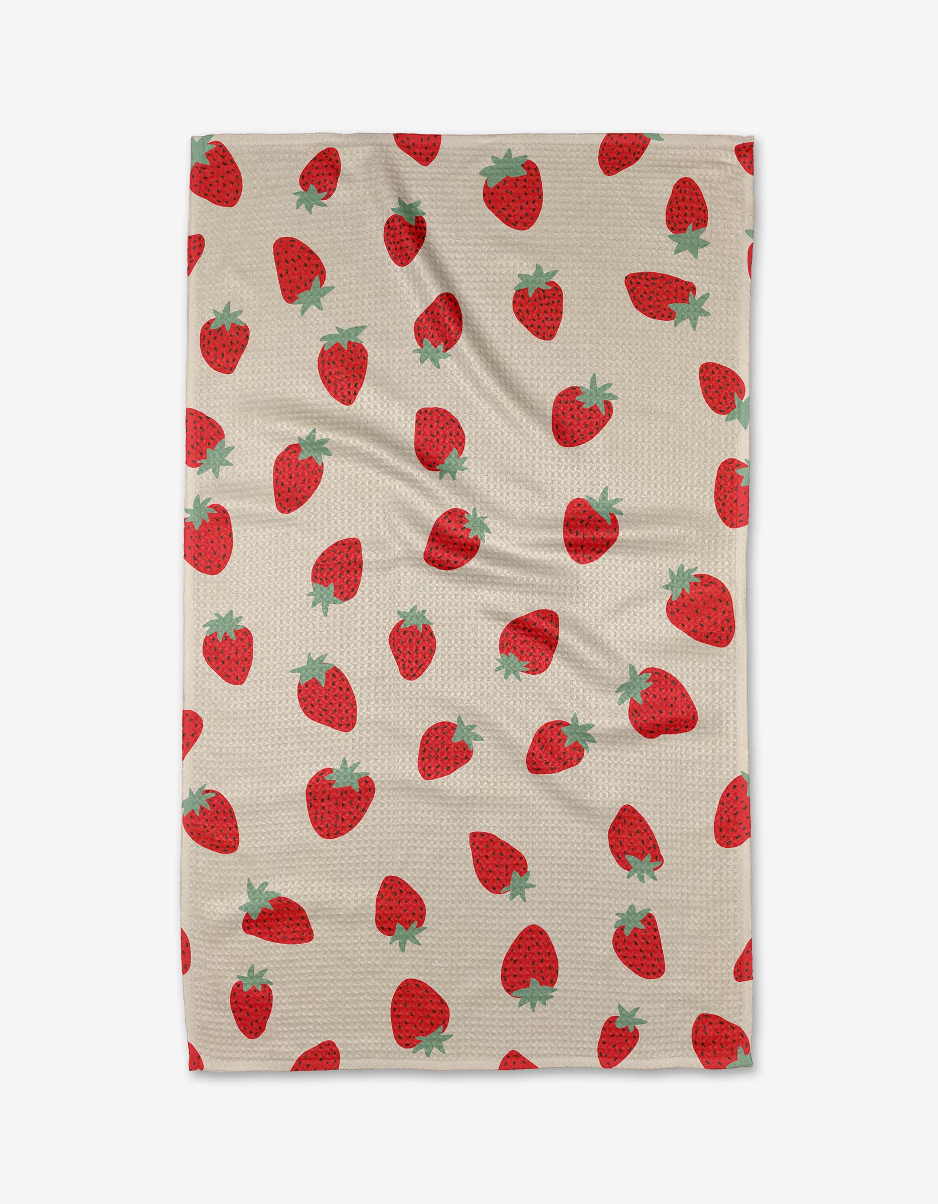 The Purely Kaylie Strawberry Shortcake blanket features a red strawberry pattern with green tops on beige, made from ultra-absorbent Geoweave fabric for style and comfort.