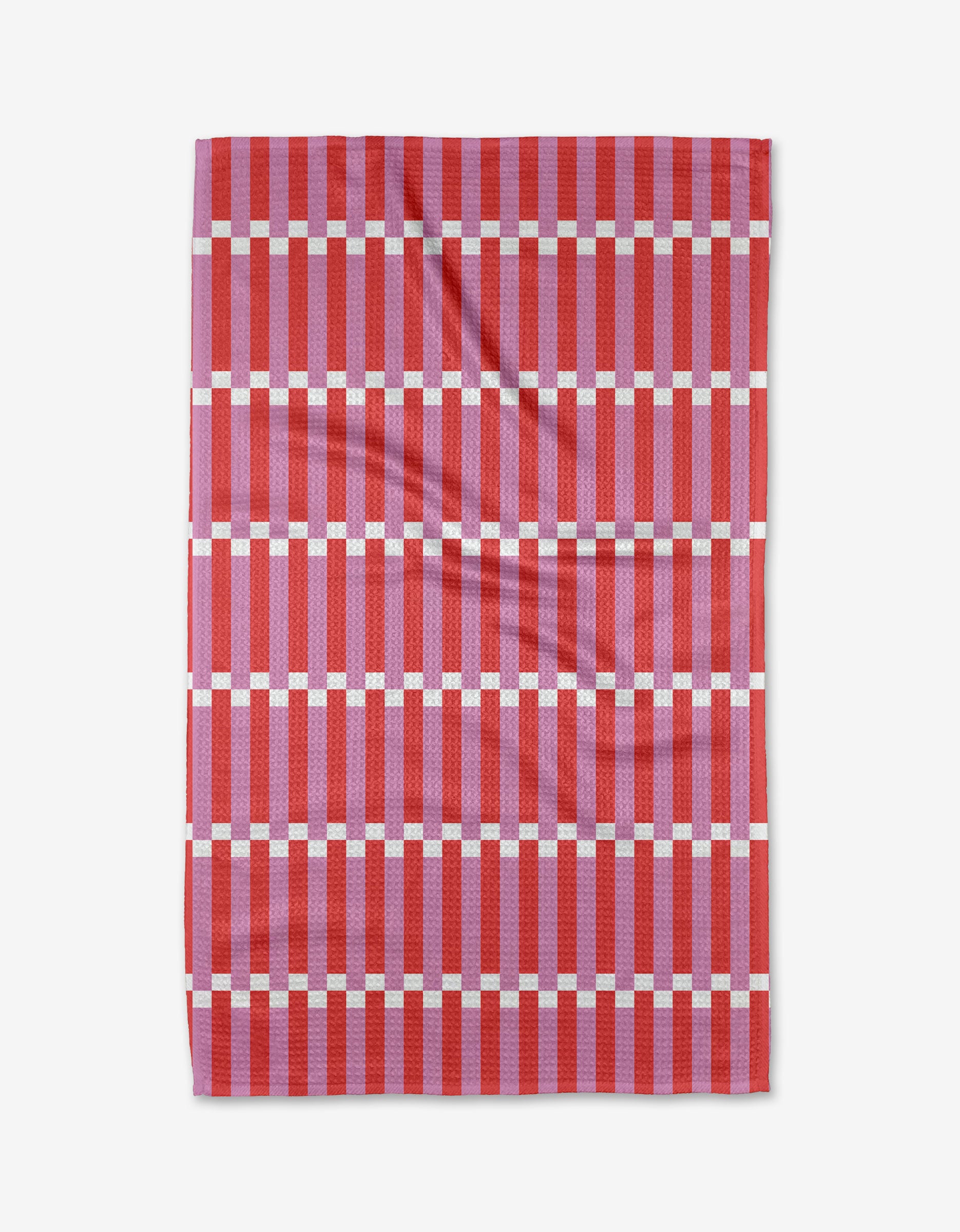 The Buy Guide’s Stripe Block - Pink Red Tea Towel features a rectangular Geoweave fabric with a geometric grid pattern in red, pink, and white stripes. Ultra-absorbent and slightly wrinkled, its shown flat on a white background.