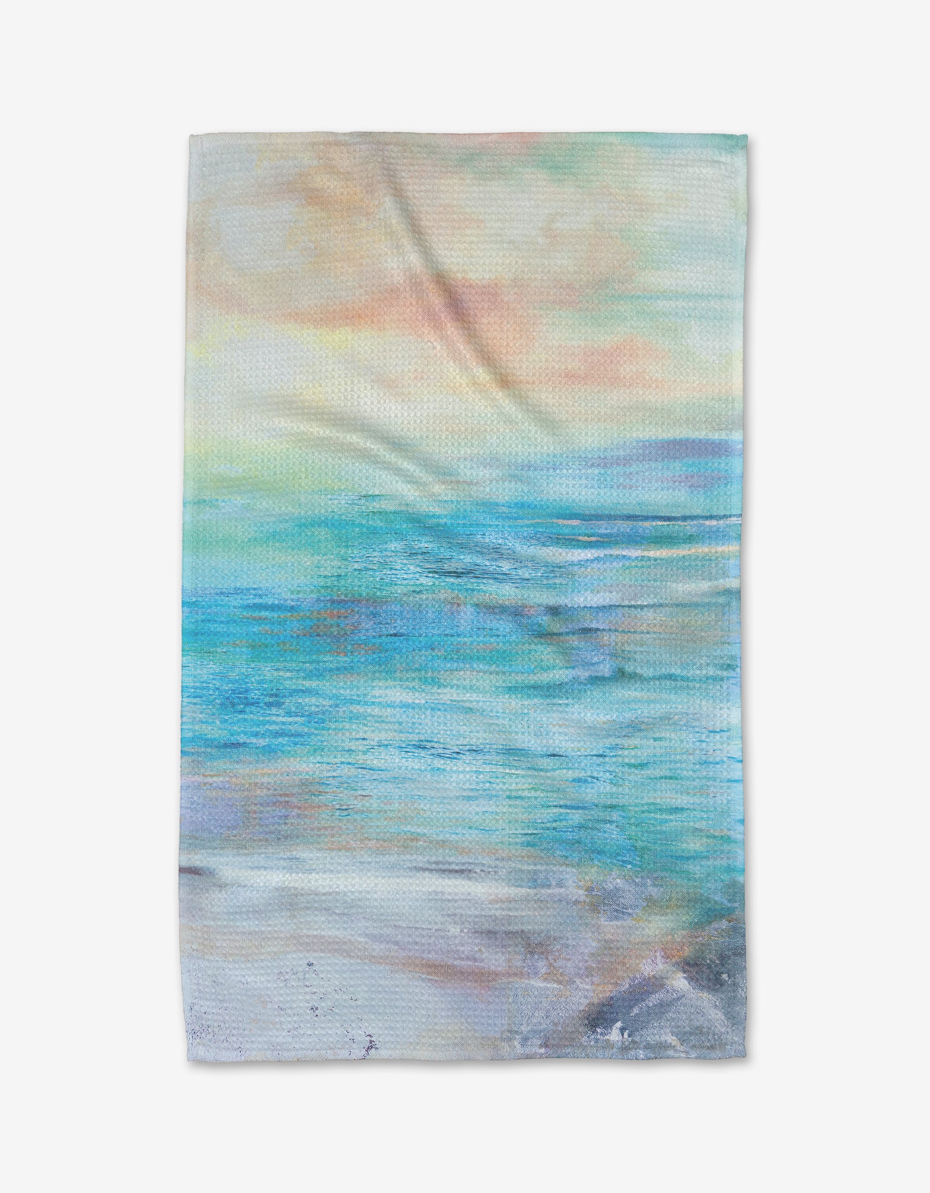 The Summer Sun tea towel by Stefanie Bales features a soft, pastel impressionist seascape with blue-green water, sandy shore, and an orange-pink sky. Made from durable Geoweave™ fabric.