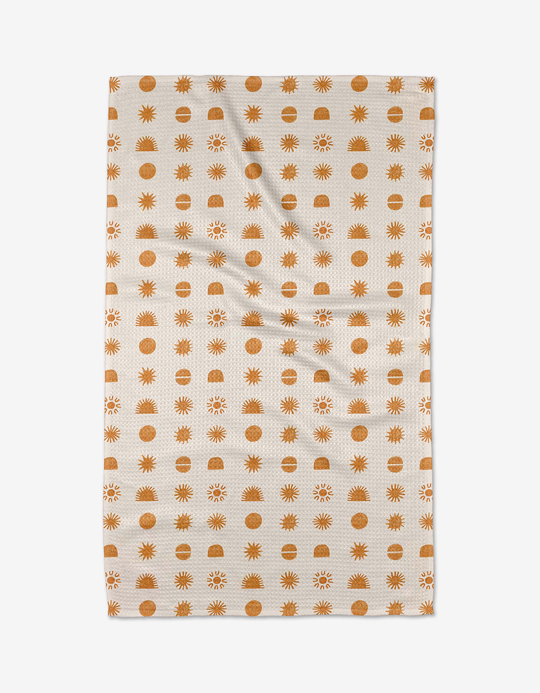 The Jen B. Peters Sunshine tea towel features a beige background with rows of orange suns and circles, crafted from ultra-absorbent Geoweave™ fabric and displayed on a white background.