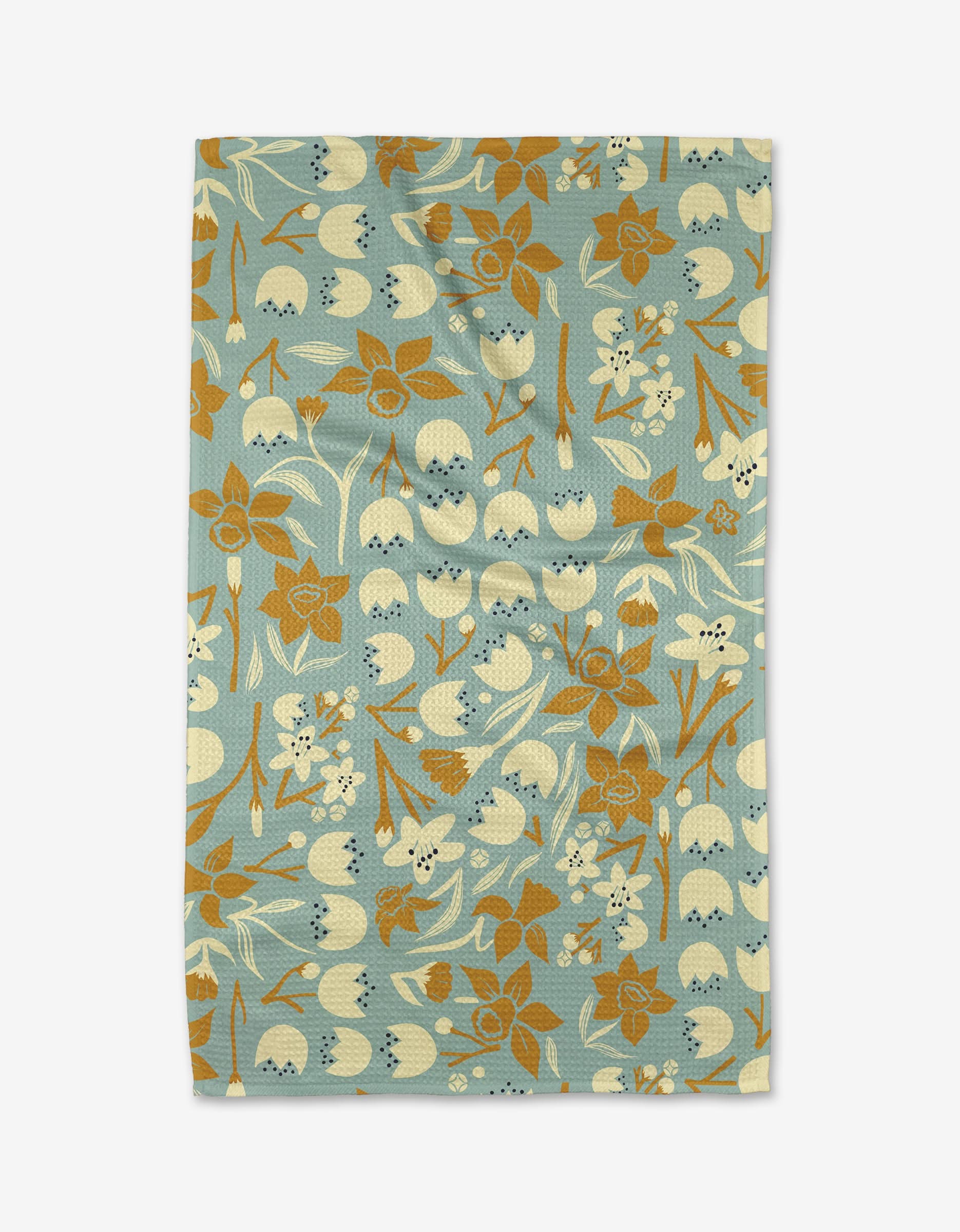 The Swedish Cherry Blossoms tea towel by Elisabeth Wing features cream and brown retro flowers and leaves on a blue background. Made from recycled materials, it blends vintage style with eco-friendly design.