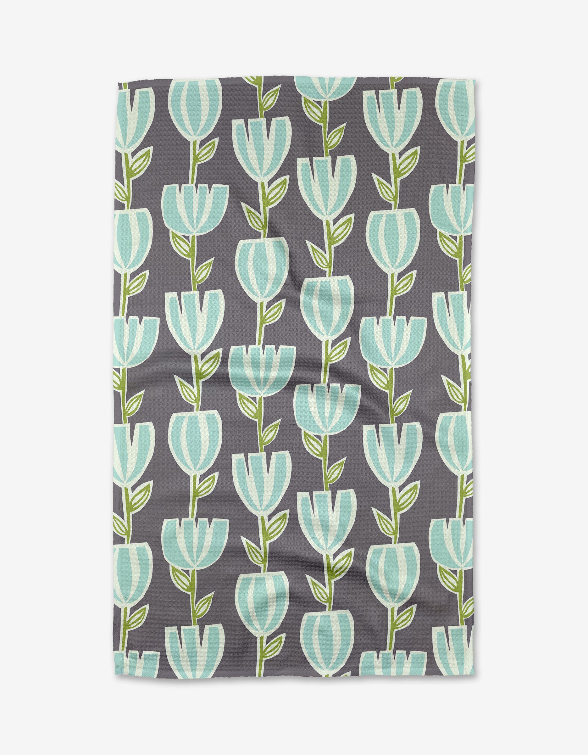 The Tulips for Days Geoweave tea towel by Lizzie Clark features a gray background with rows of stylized turquoise and white tulips and green stems.