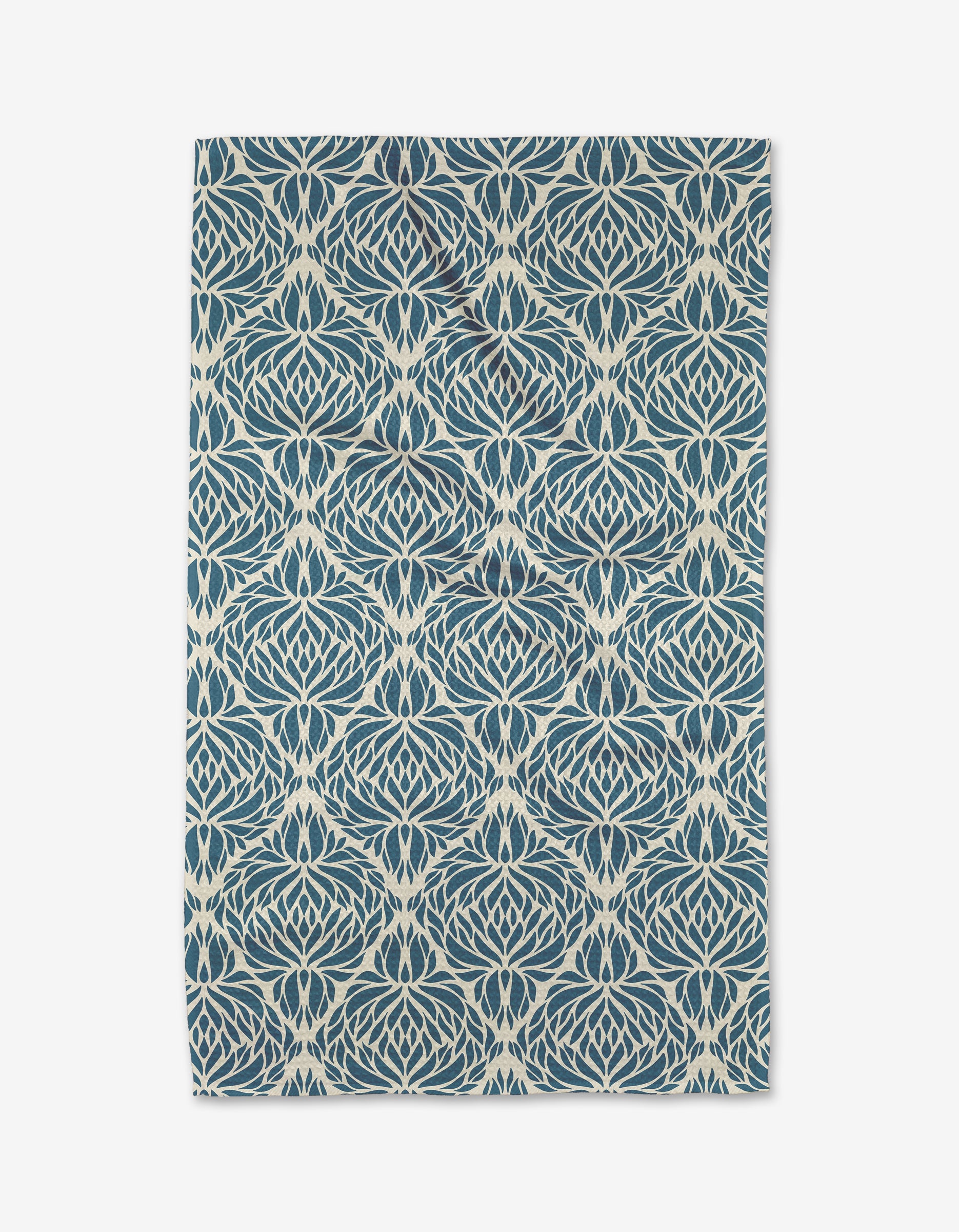 The Untangled tea towel by Rebecca Woolbright features a detailed blue and white geometric floral pattern on white, displayed flat with gently uneven edges.