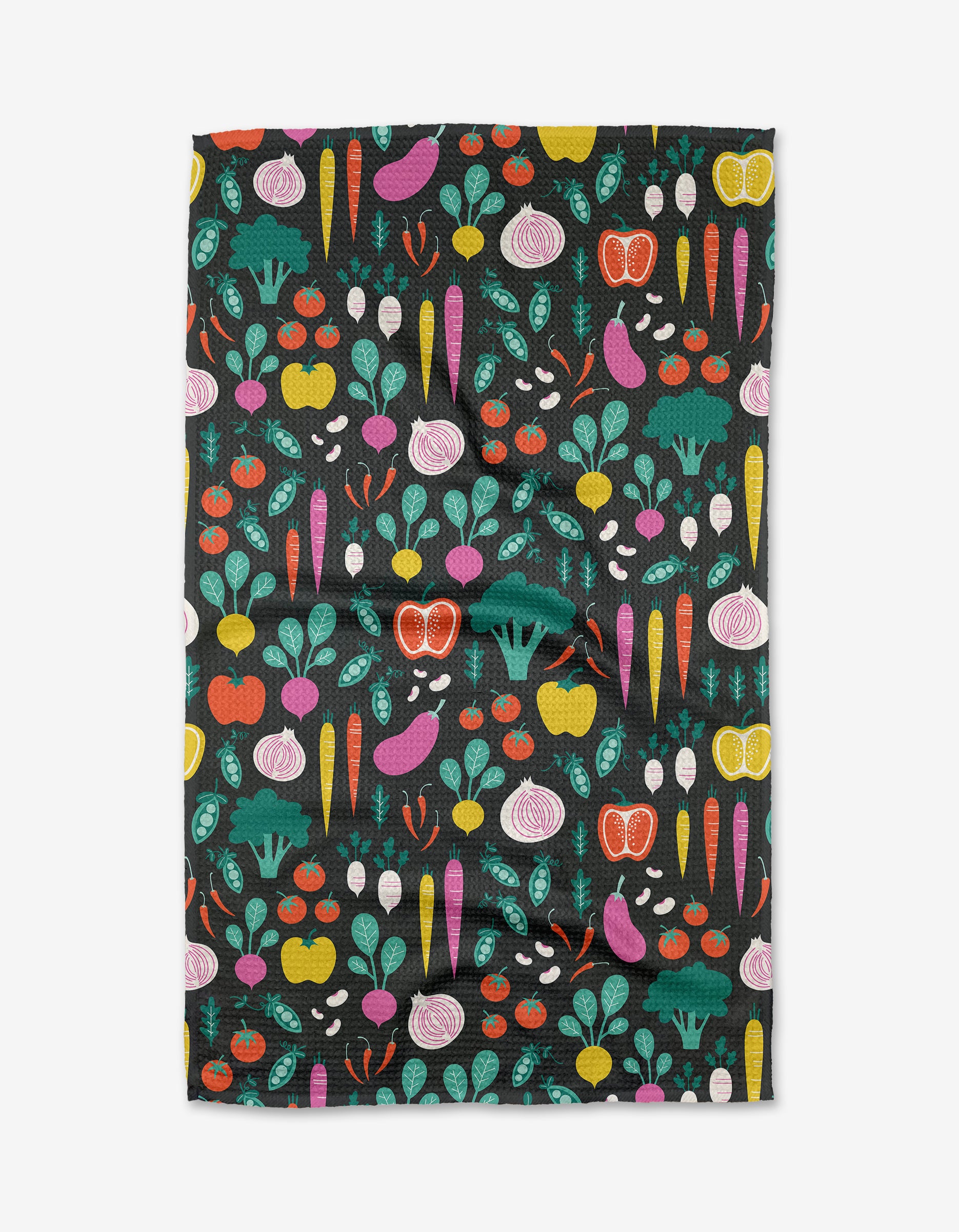 The Megan Kampa Veggies tea towel showcases a colorful array of carrots, beets, broccoli, onions, tomatoes, and peppers on black Geoweave™ fabric for lasting durability.