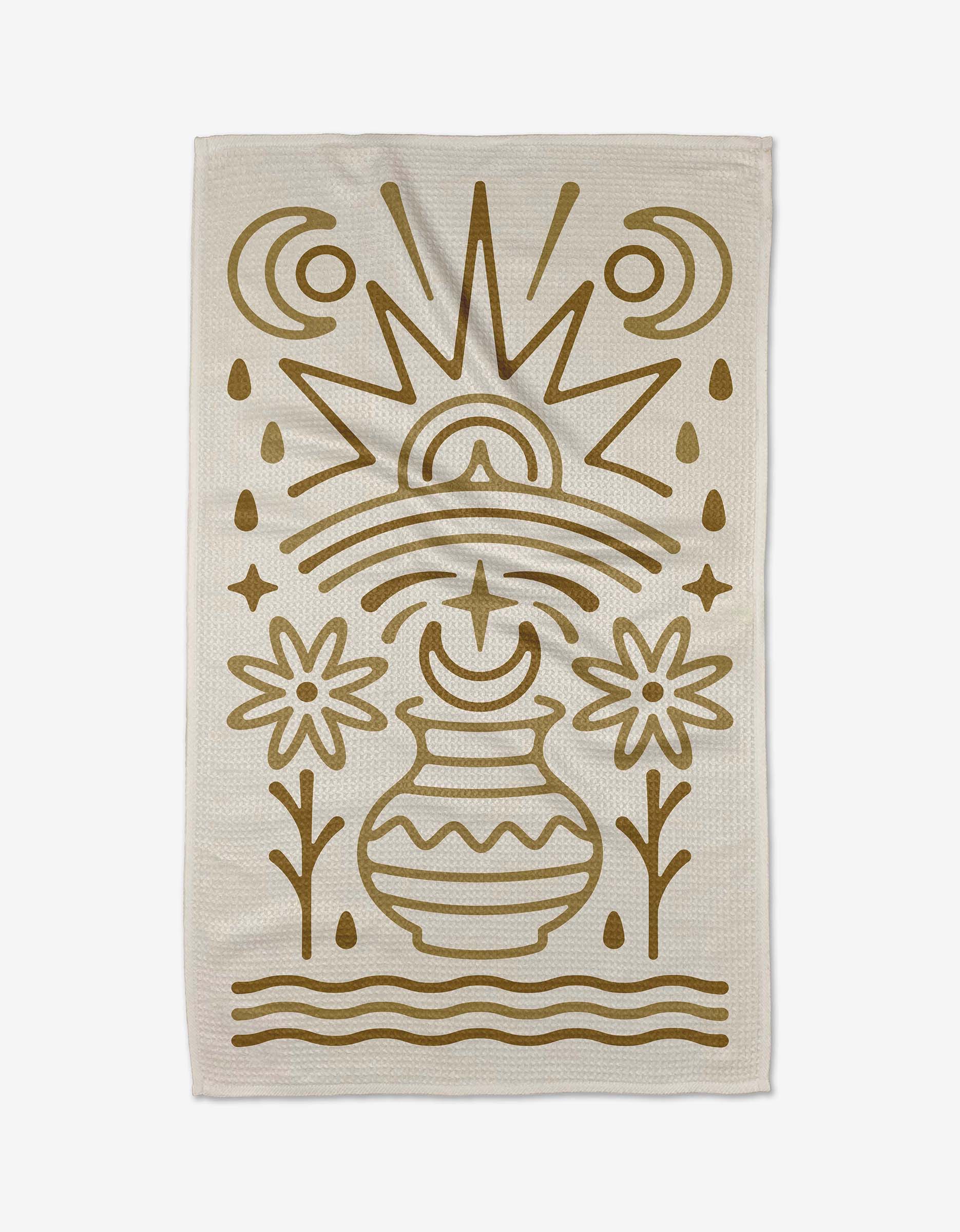 The Vessel tea towel by Adam Nienow features a beige, eco-friendly design with a stylized golden vase, flowers, crescent moons, water droplets, and a radiant sun in abstract geometric lines inspired by nature.